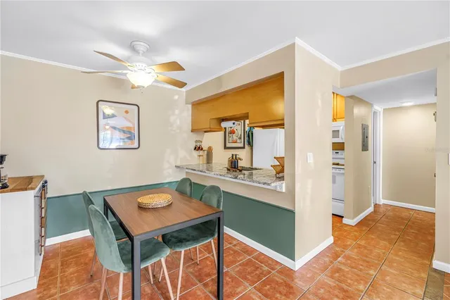 a view of a kitchen and dining room