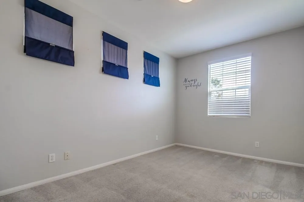 1298 Fools Gold Way, Unit 4 Chula Vista, CA 91913 - Photo 19 of 38 an empty room with windows