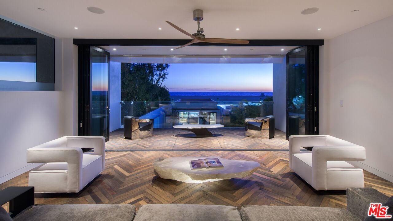 924 Palisades Beach Road Santa Monica, CA 90403 - Photo 15 of 54 a living room with furniture and a fireplace