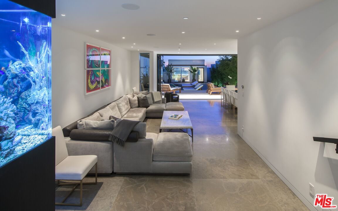 924 Palisades Beach Road Santa Monica, CA 90403 - Photo 20 of 54 a living room with furniture and a fireplace