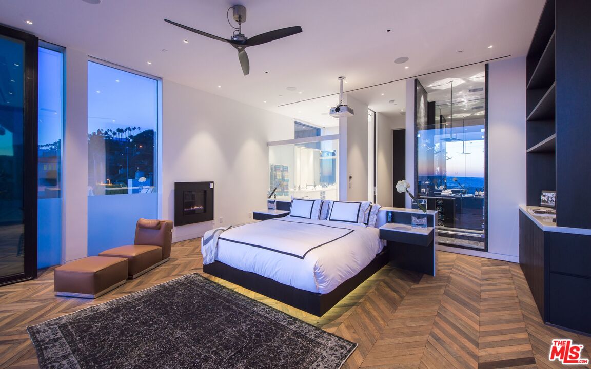 924 Palisades Beach Road Santa Monica, CA 90403 - Photo 26 of 54 a bedroom with a bed large mirror and furniture
