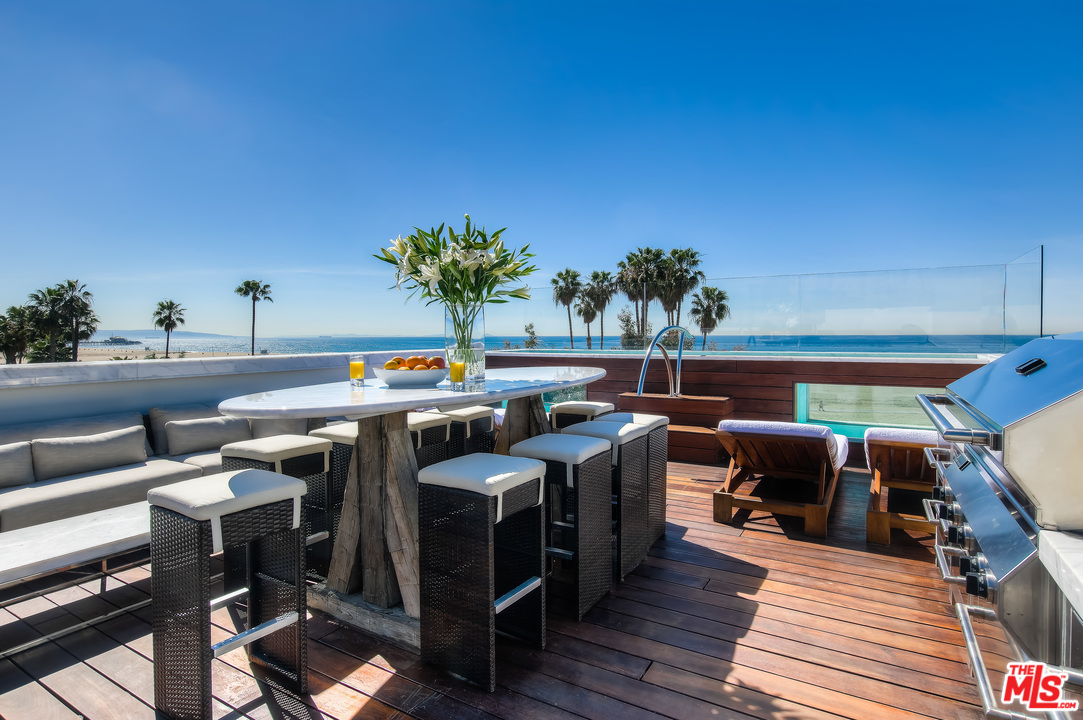 924 Palisades Beach Road Santa Monica, CA 90403 - Photo 3 of 54 a view of a chairs and table in the patio