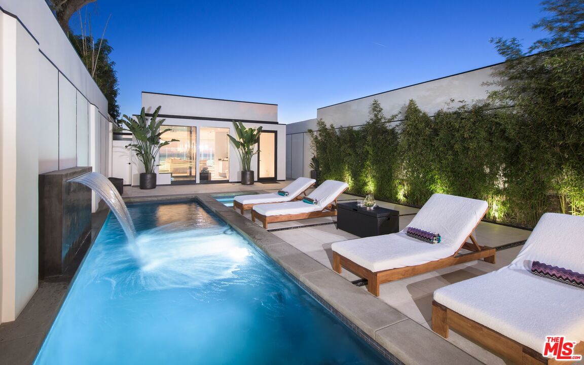 924 Palisades Beach Road Santa Monica, CA 90403 - Photo 40 of 54 a view of a patio with couches chairs and a table