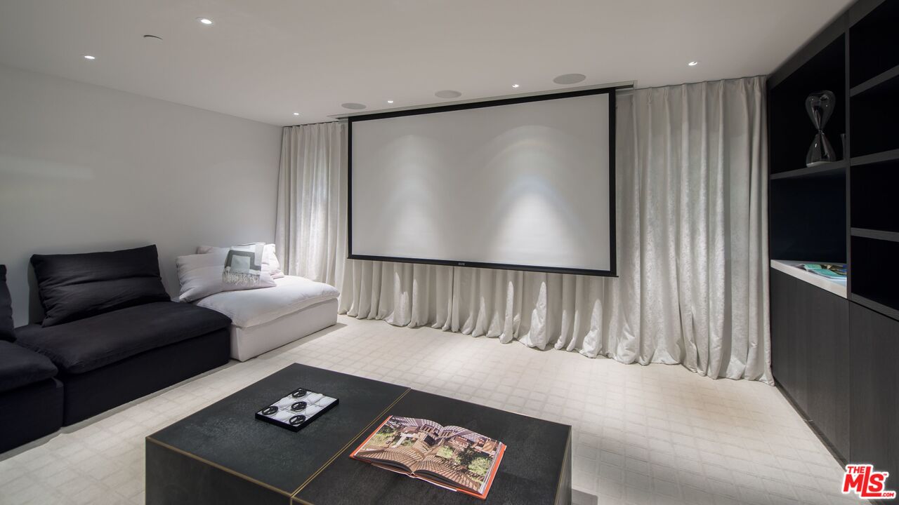924 Palisades Beach Road Santa Monica, CA 90403 - Photo 45 of 54 a living room with furniture and a flat screen tv