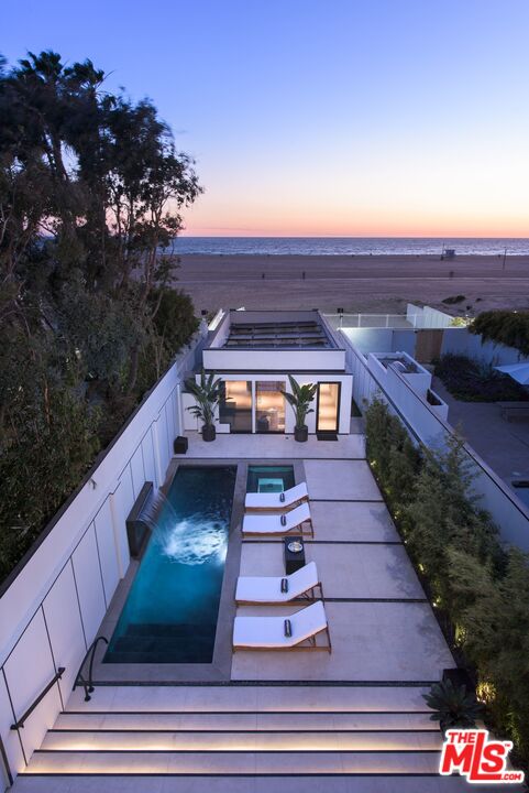 924 Palisades Beach Road Santa Monica, CA 90403 - Photo 50 of 54 a view of a balcony with two chairs and a table