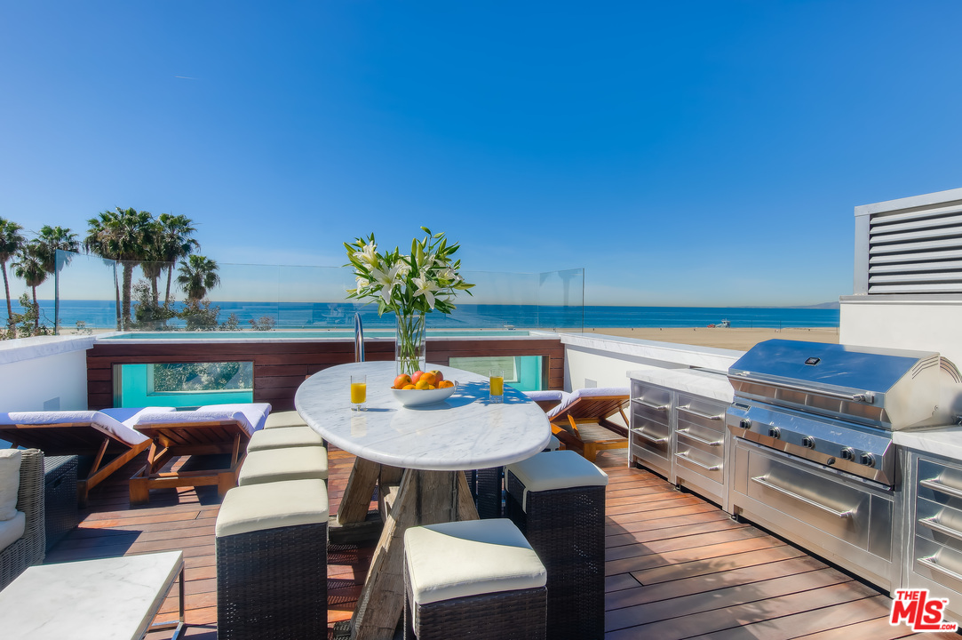 924 Palisades Beach Road Santa Monica, CA 90403 - Photo 54 of 54 a outdoor sitting area with furniture and wooden floor