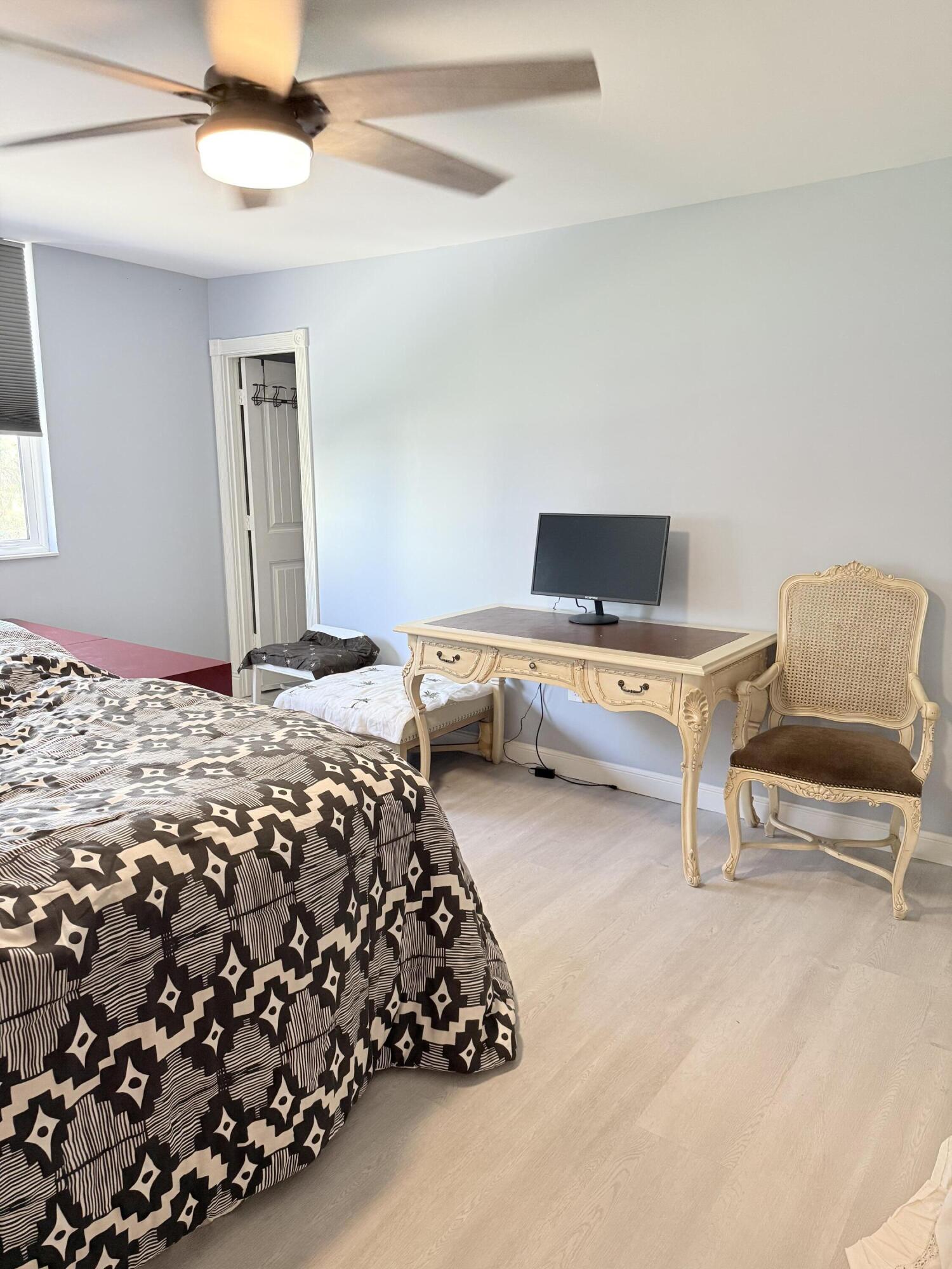 3450 South Ocean Boulevard, Unit 2220 Palm Beach, FL 33480 - Photo 11 of 36 a bedroom with bed and window