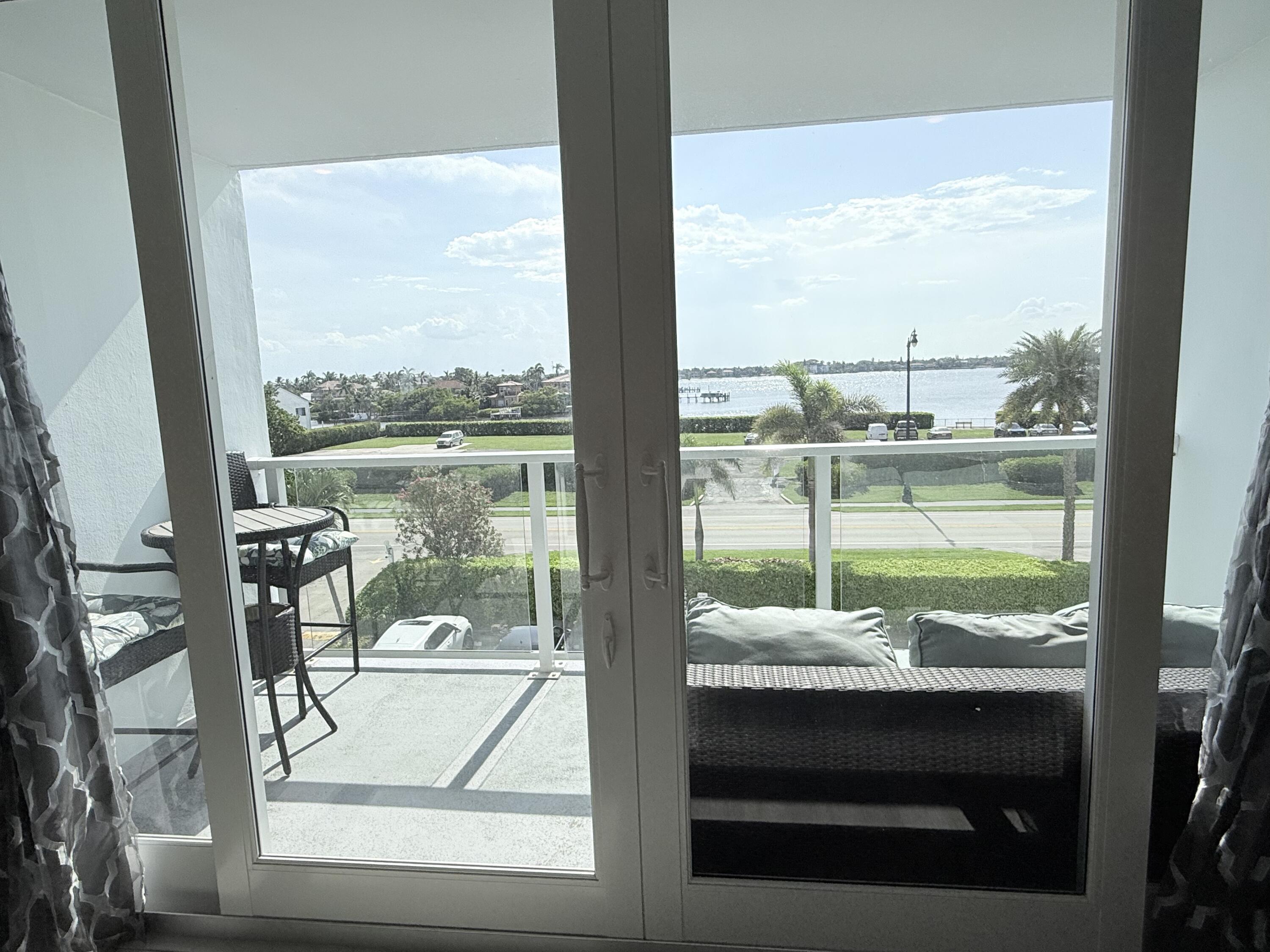 3450 South Ocean Boulevard, Unit 2220 Palm Beach, FL 33480 - Photo 14 of 36 a view of a balcony with lake view and a ocean view