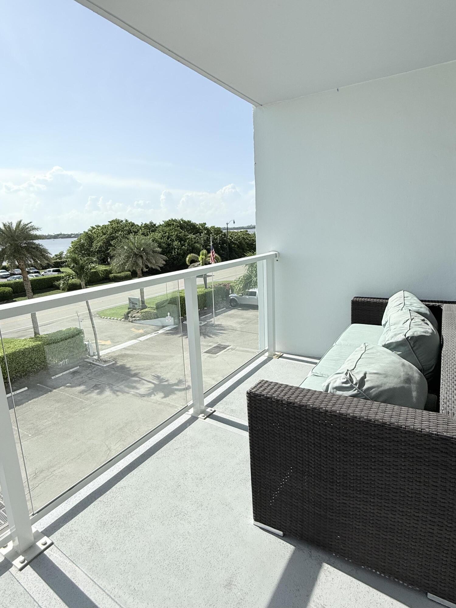3450 South Ocean Boulevard, Unit 2220 Palm Beach, FL 33480 - Photo 15 of 36 a living room with a bed