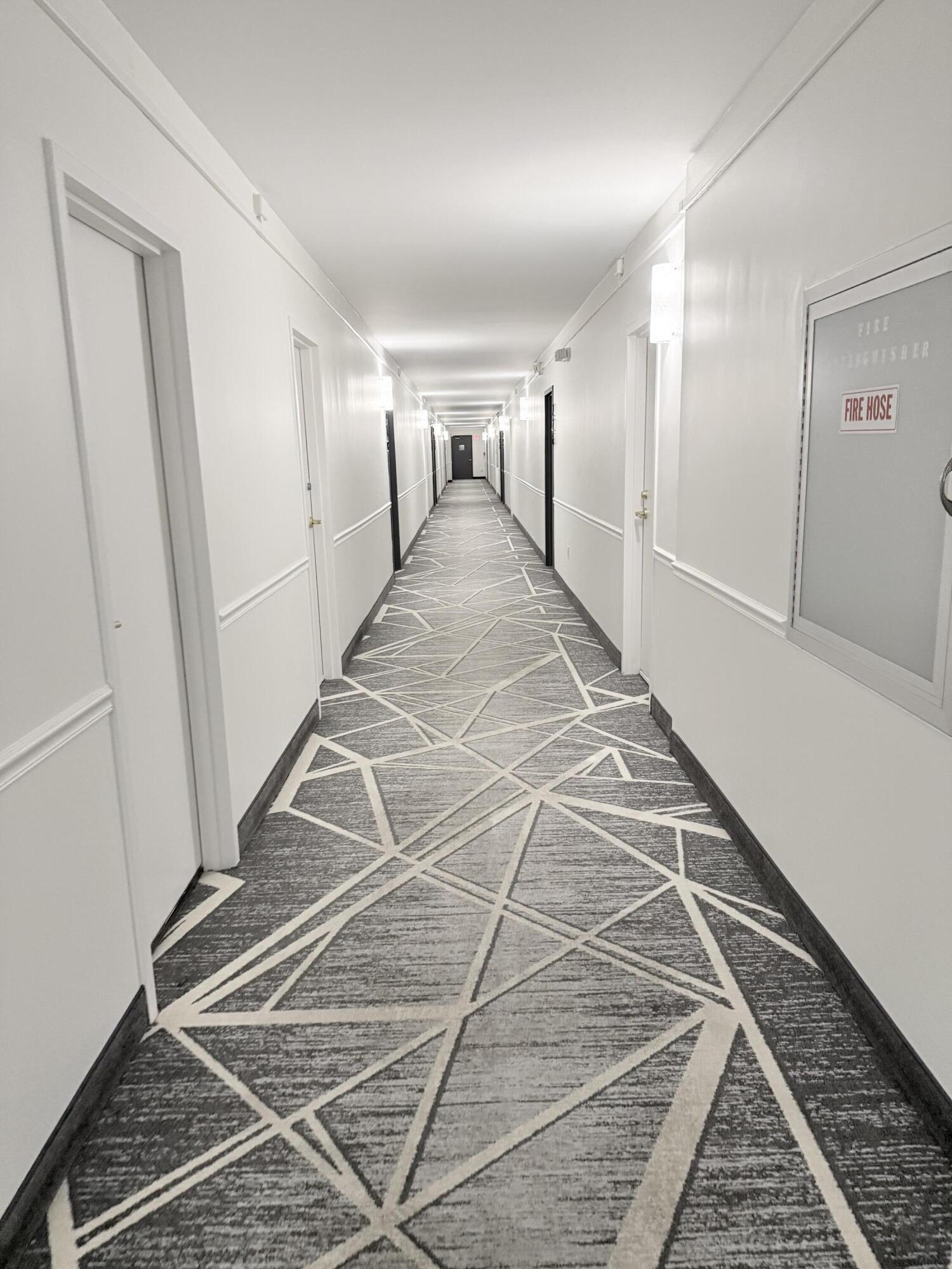 3450 South Ocean Boulevard, Unit 2220 Palm Beach, FL 33480 - Photo 16 of 36 a view of a hallway