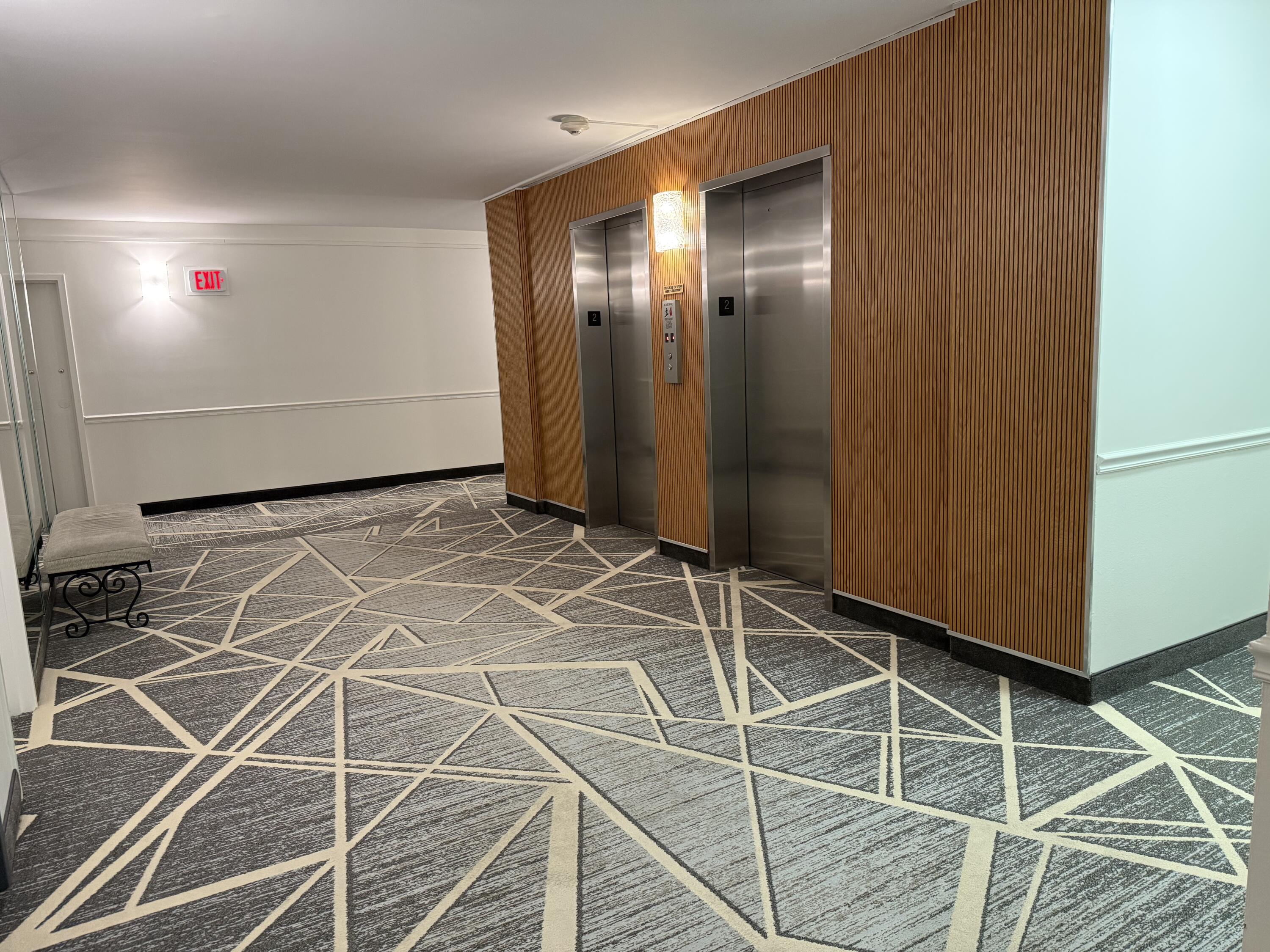 3450 South Ocean Boulevard, Unit 2220 Palm Beach, FL 33480 - Photo 17 of 36 an empty room with wooden floor