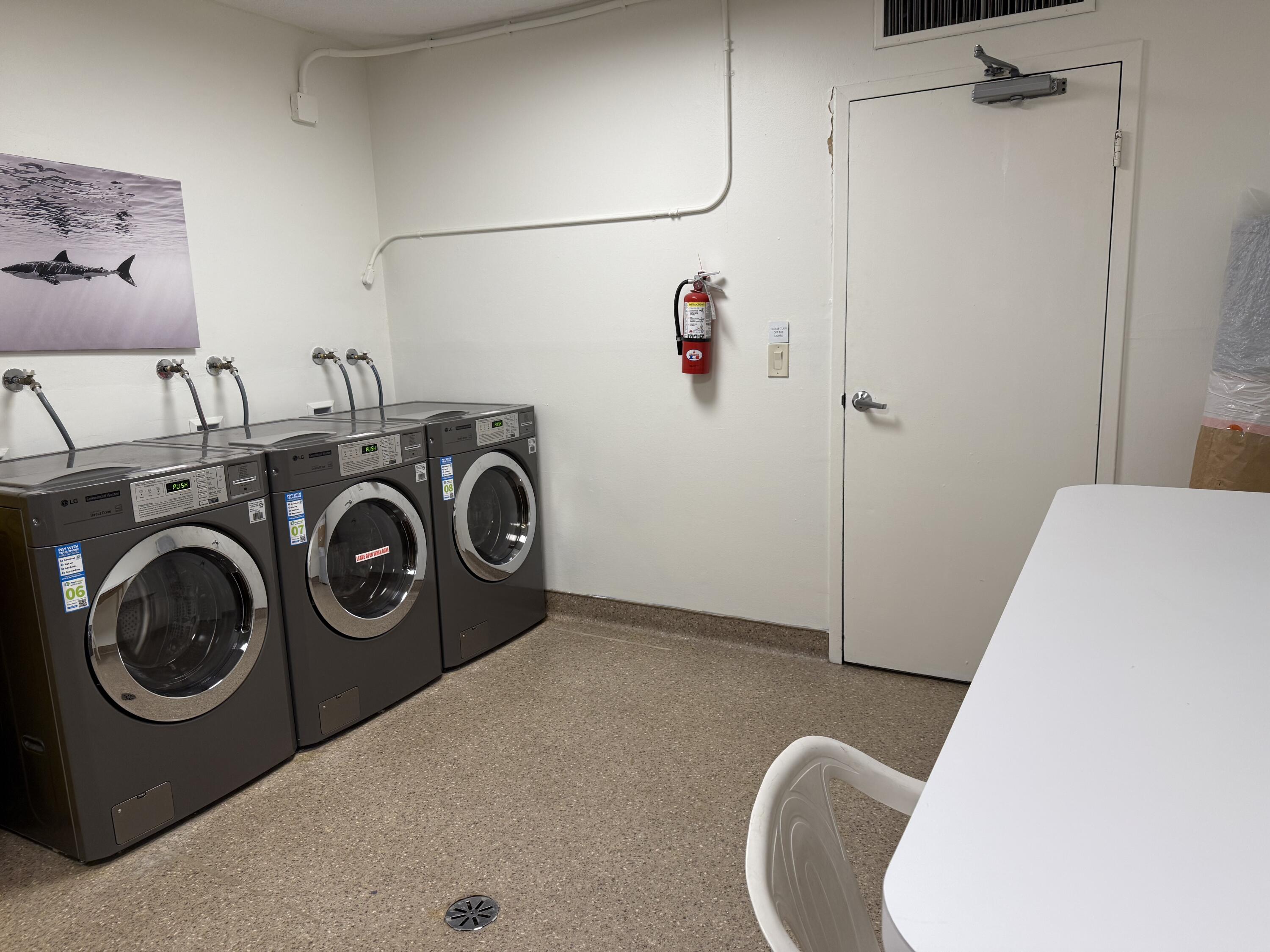 3450 South Ocean Boulevard, Unit 2220 Palm Beach, FL 33480 - Photo 18 of 36 a utility room with dryer and washer