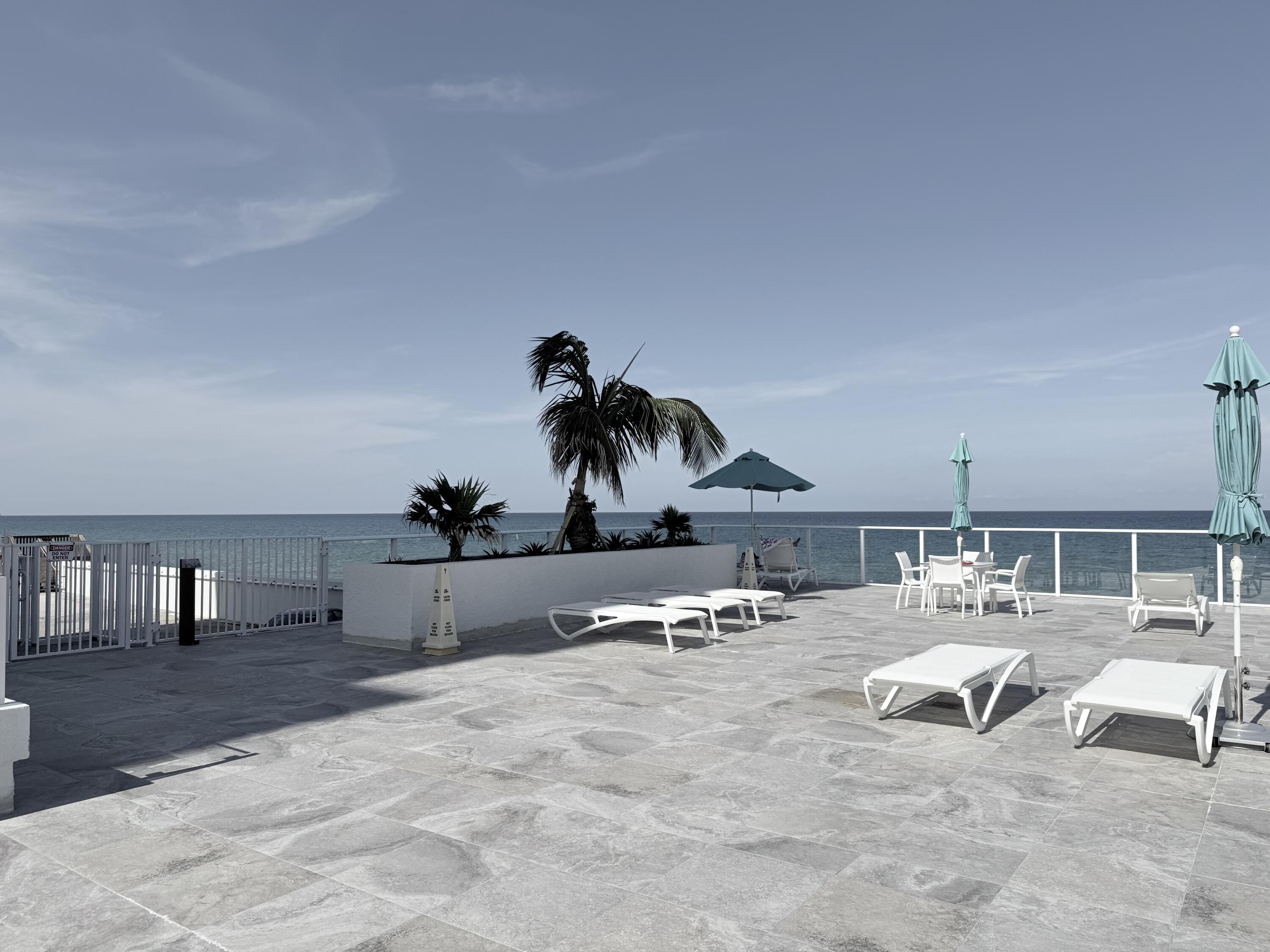 3450 South Ocean Boulevard, Unit 2220 Palm Beach, FL 33480 - Photo 26 of 36 a bed room with furniture and a table