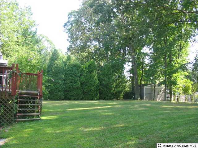 122 Darien Road Howell, NJ 07731 - Photo 3 of 3 a view of a garden with trees