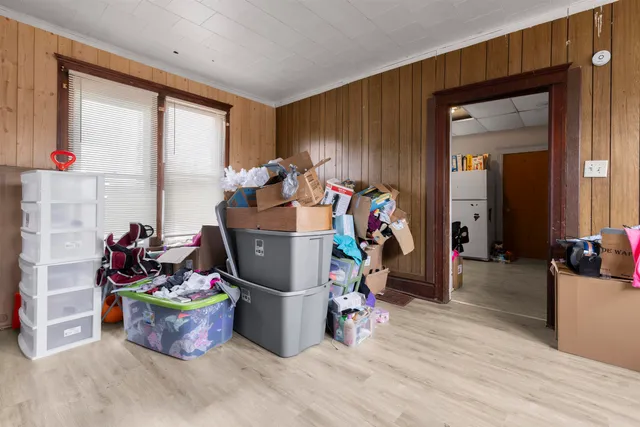 a living room filled with furniture and a window