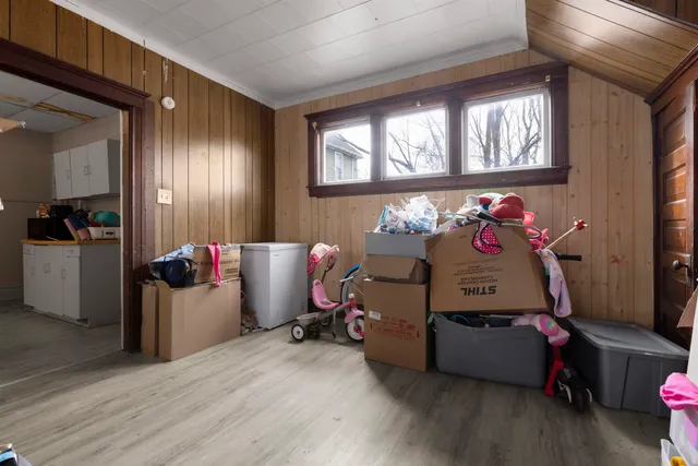 a bedroom with furniture and a window