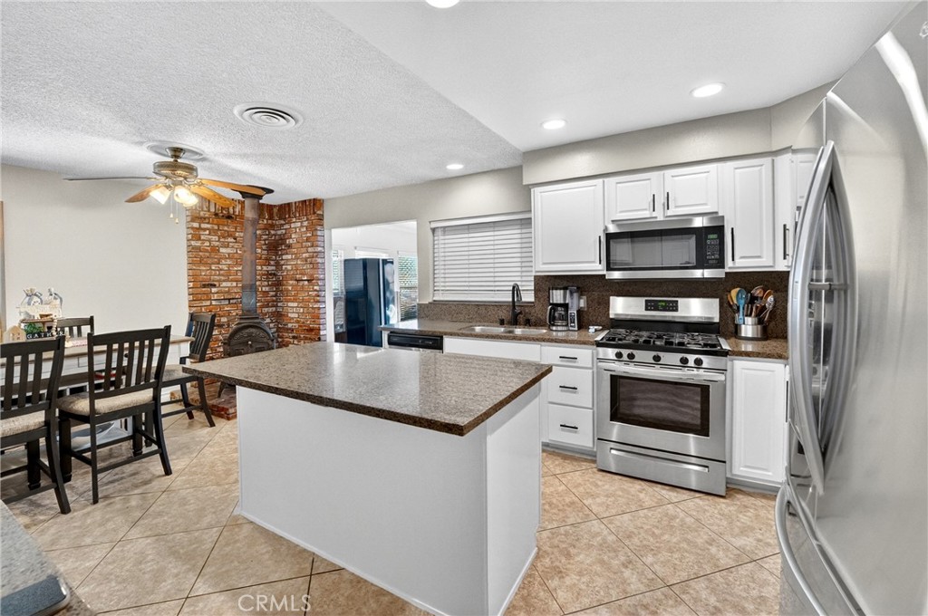 2501 East Avenue R4 Palmdale, CA 93550 - Photo 20 of 40 Warm up in the winter with this amazing kitchen set up with a wood burning stove.