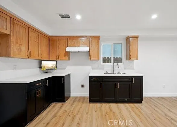 a kitchen with a sink and cabinets