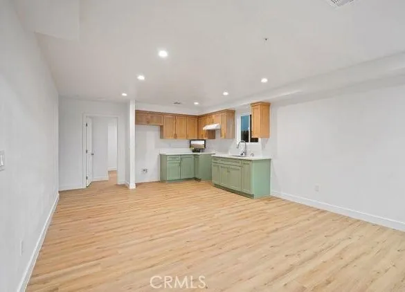 a view of kitchen with wooden floor