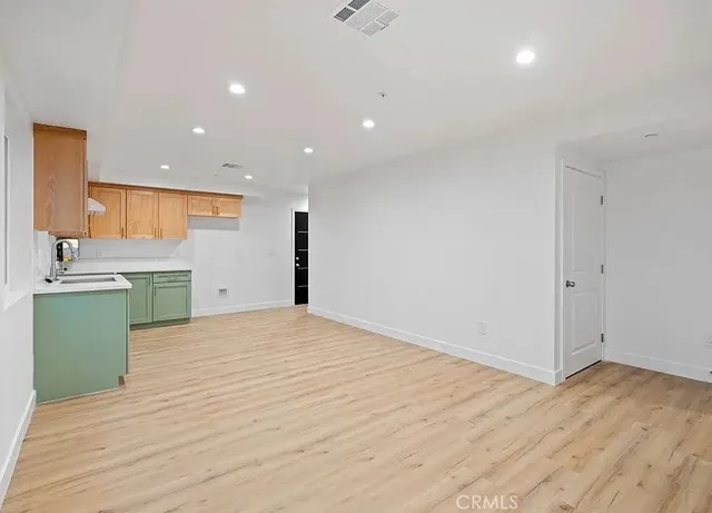 a view of a kitchen with a sink and a kitchen