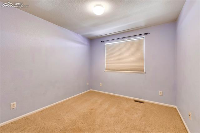 9231 Ballybunion Road Peyton, CO 80831 - Photo 15 of 26 Upper level bedroom 1.