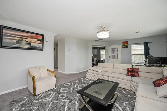 a living room with furniture and a couch