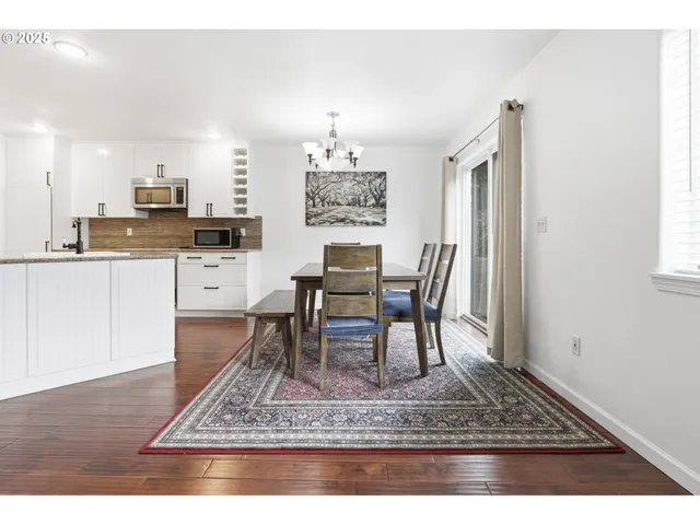 a dining room with a dining table and chairs