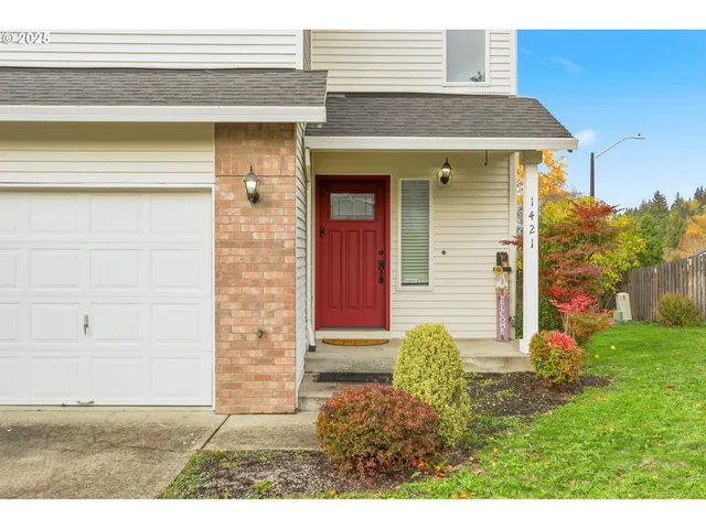 a view of a house with small yard