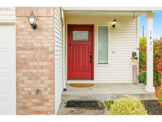 a view of a door and brick walls