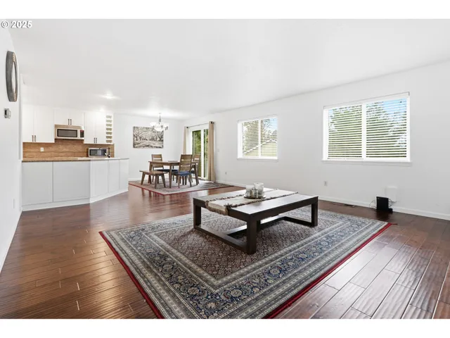a living room with furniture and a rug
