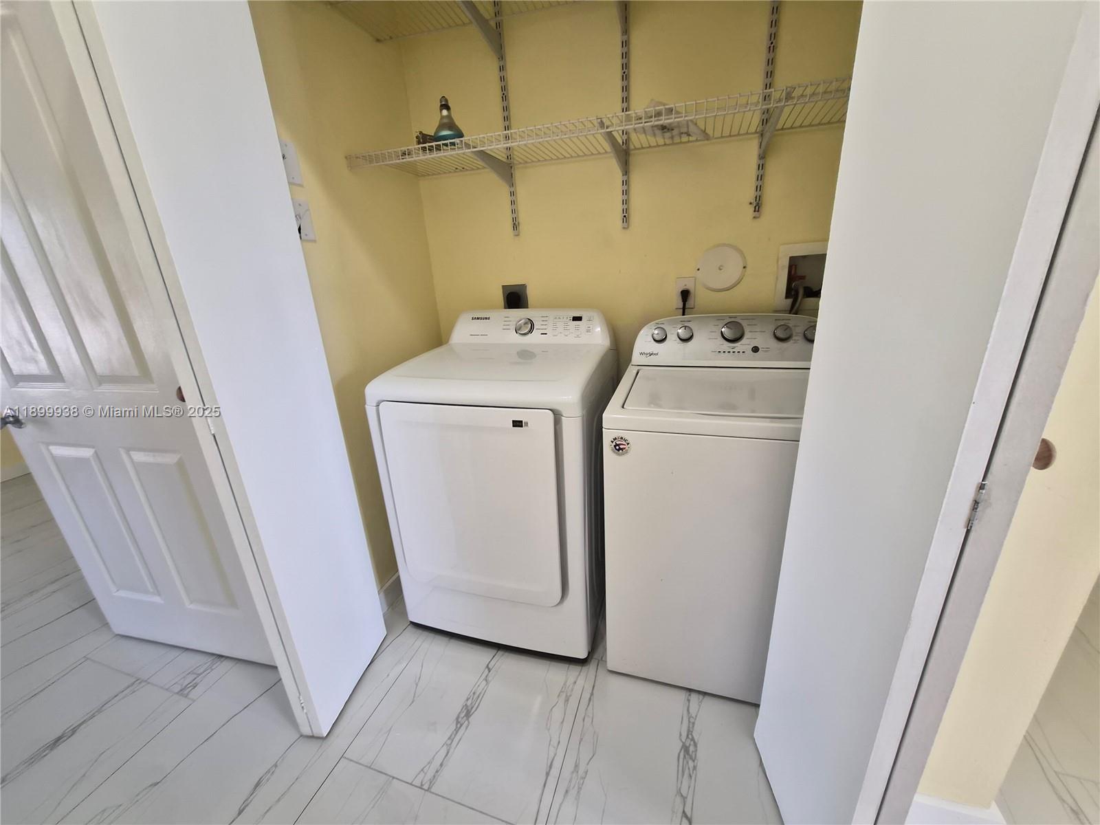 1209 Northwest 27th Avenue Pompano Beach, FL 33069 - Photo 16 of 22 a utility room with dryer and washer