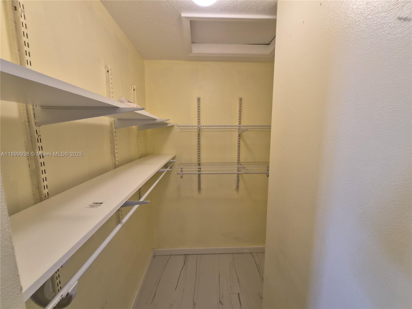 1209 Northwest 27th Avenue Pompano Beach, FL 33069 - Photo 17 of 22 a view of walk in closet