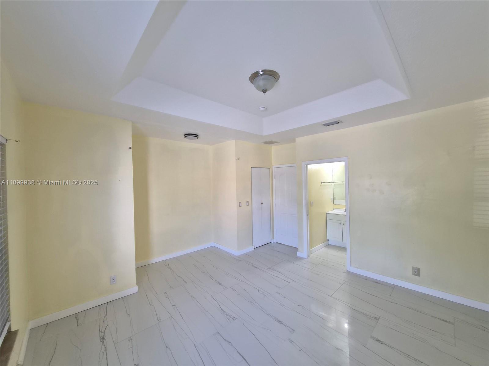 1209 Northwest 27th Avenue Pompano Beach, FL 33069 - Photo 20 of 22 a view of an empty room with wooden floor