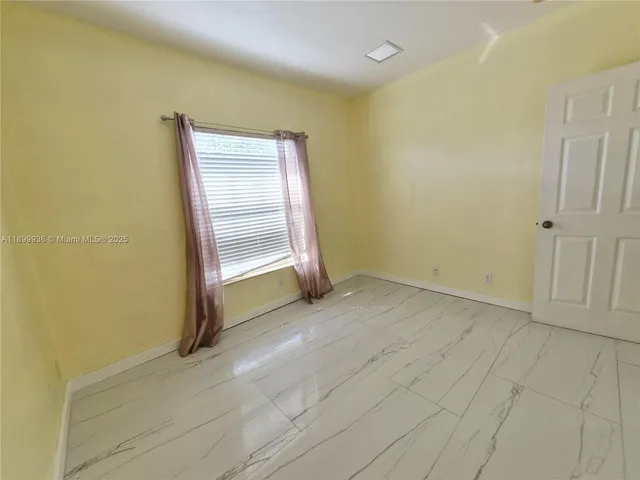 a view of a room with drop ceiling