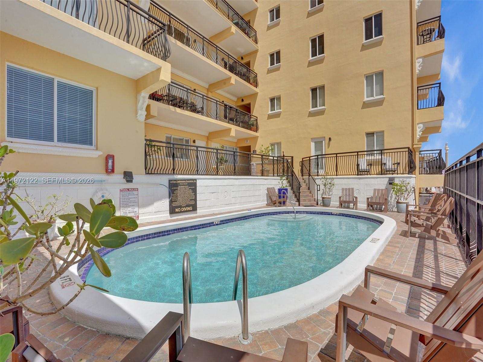 1815 North Surf Road, Unit 202 Hollywood, FL 33019 - Photo 28 of 32 a view of outdoor space patio and swimming pool