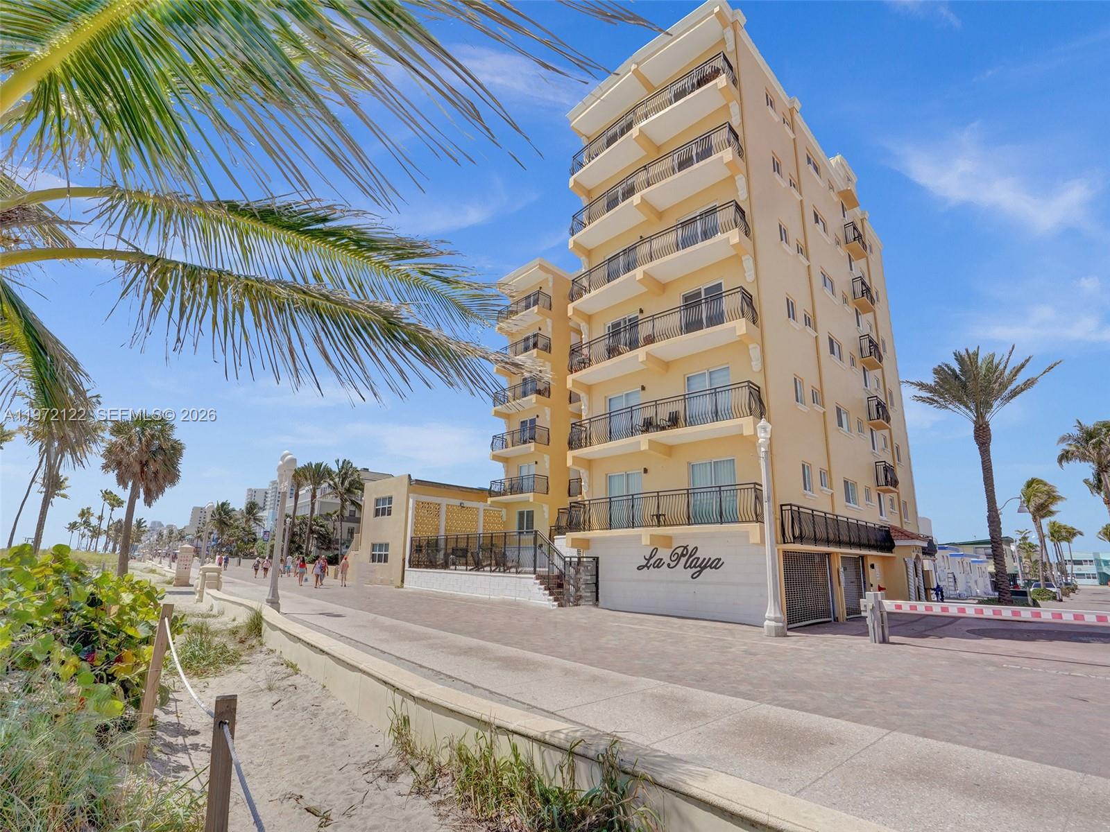 1815 North Surf Road, Unit 202 Hollywood, FL 33019 - Photo 30 of 32 a view of a tall building next to a road