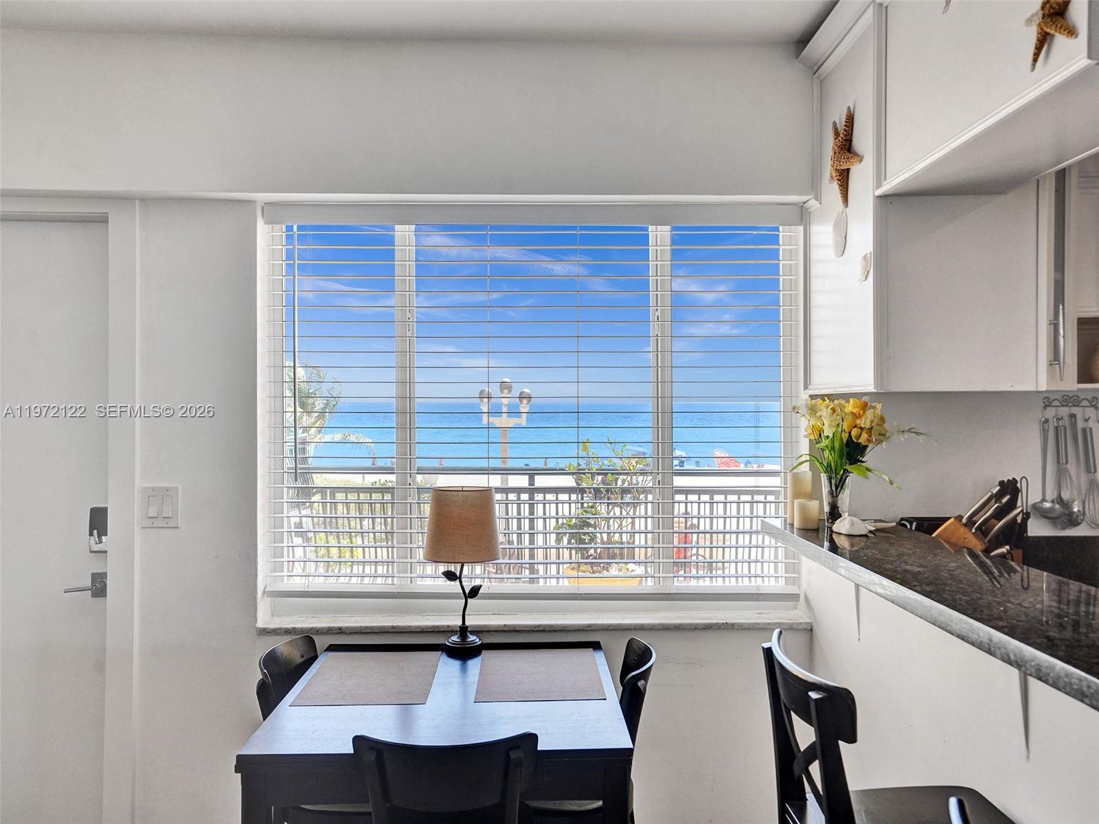 1815 North Surf Road, Unit 202 Hollywood, FL 33019 - Photo 3 of 32 a view of a kitchen with a sink and cabinets