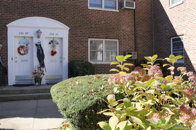 a backyard of a house with outdoor seating