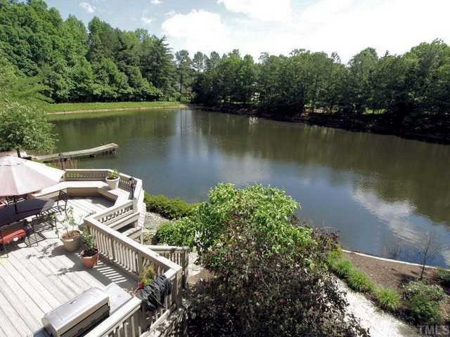 8804 Highhill Road Raleigh, NC 27615 - Photo 11 of 12 an aerial view of a house with a lake view