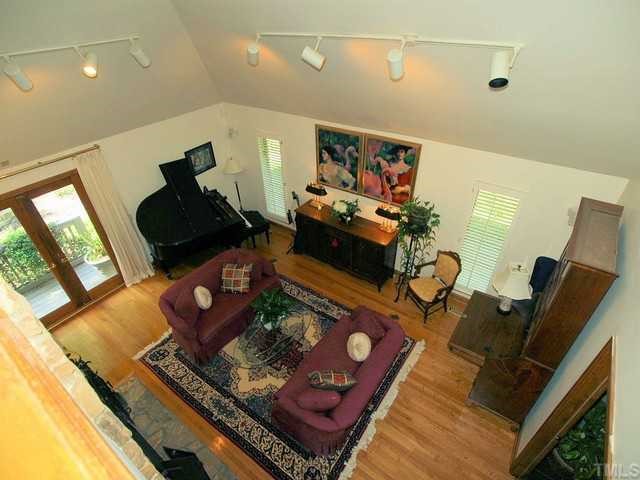 8804 Highhill Road Raleigh, NC 27615 - Photo 3 of 12 a living room with furniture and a wooden floor