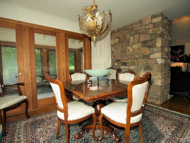 8804 Highhill Road Raleigh, NC 27615 - Photo 4 of 12 a view of a dining room with furniture and chandelier