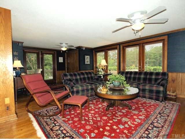 8804 Highhill Road Raleigh, NC 27615 - Photo 5 of 12 a living room with furniture and a large window