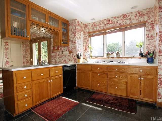 8804 Highhill Road Raleigh, NC 27615 - Photo 7 of 12 a spacious bathroom with a granite countertop sink mirror and a bathtub