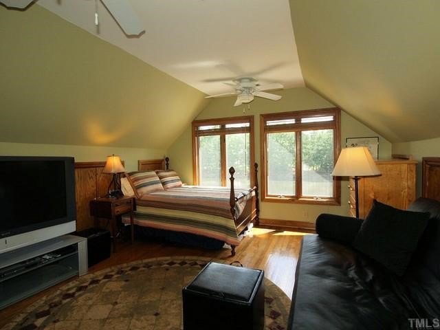 8804 Highhill Road Raleigh, NC 27615 - Photo 9 of 12 a living room with furniture and a flat screen tv
