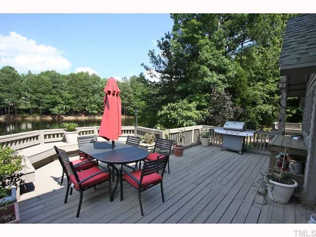 8804 Highhill Road Raleigh, NC 27615 - Photo 10 of 12 a view of a table and chairs in the roof deck