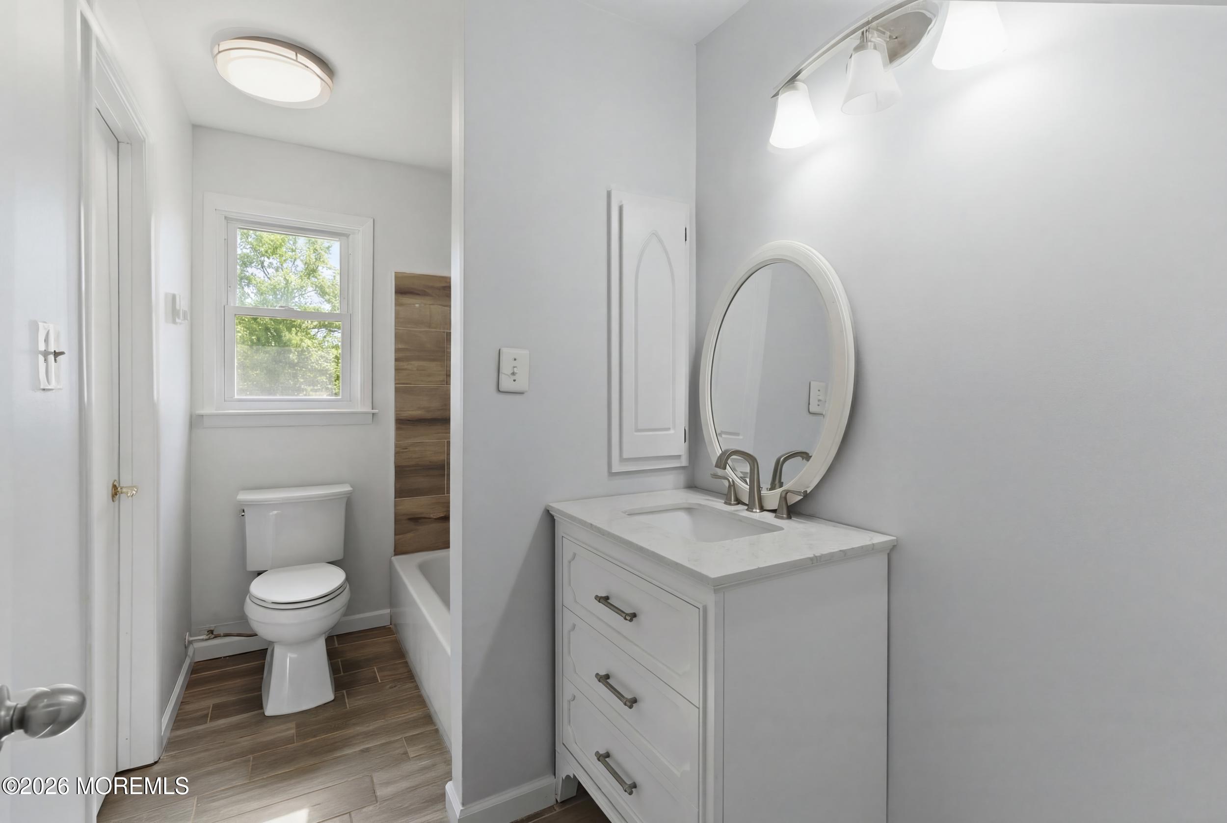 93 Baser Lane Brick, NJ 08724 - Photo 11 of 21 a bathroom with a sink toilet and a mirror