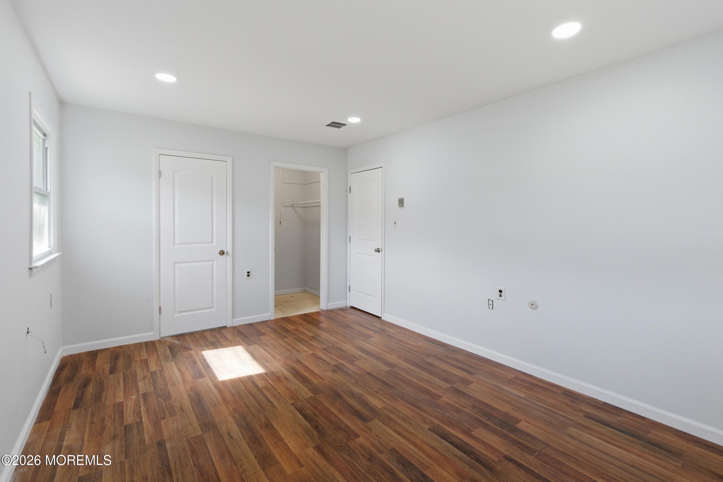 93 Baser Lane Brick, NJ 08724 - Photo 12 of 21 a view of room with wooden floor and white walls