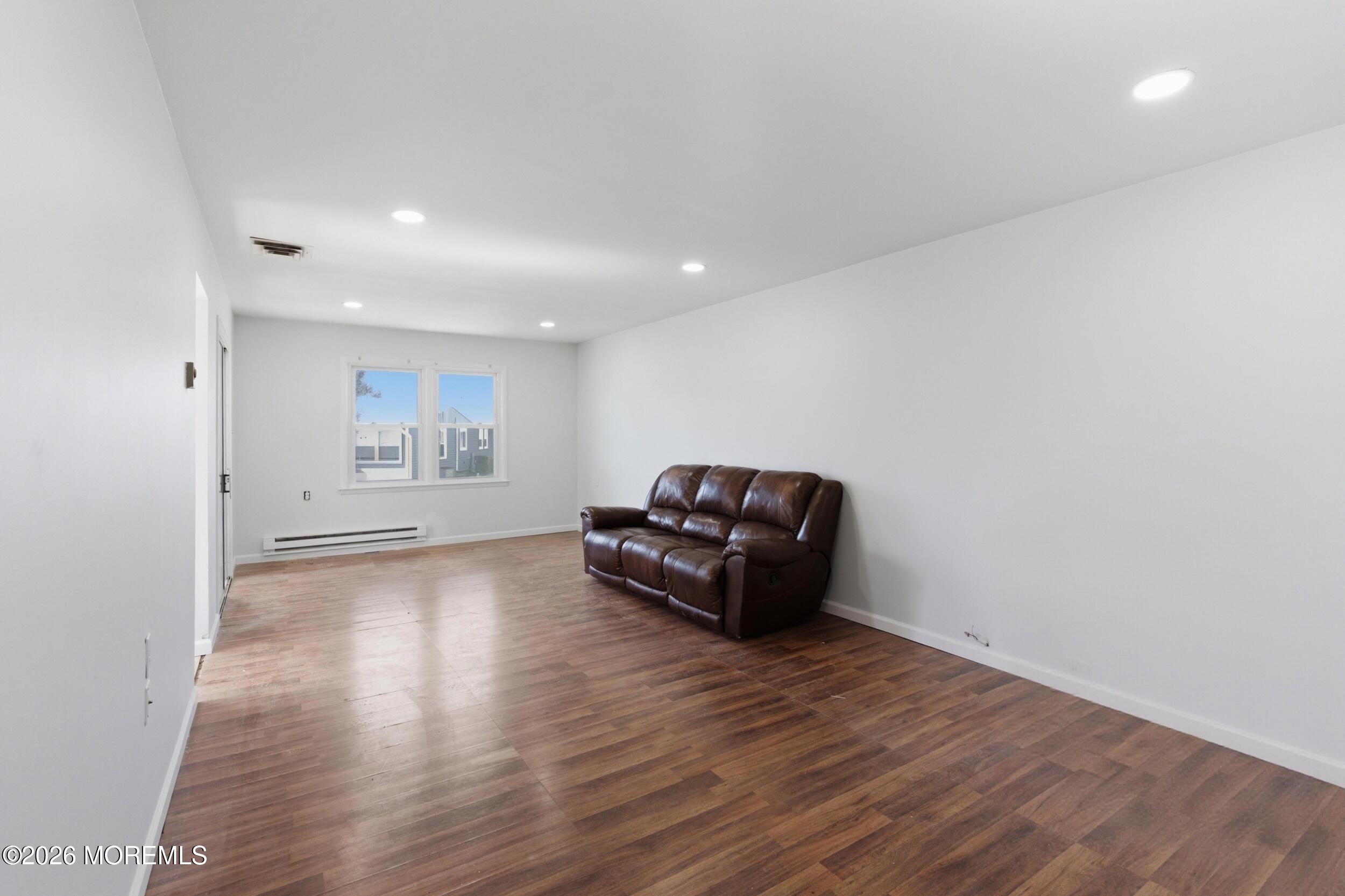 93 Baser Lane Brick, NJ 08724 - Photo 4 of 21 a living room with furniture and a wooden floor