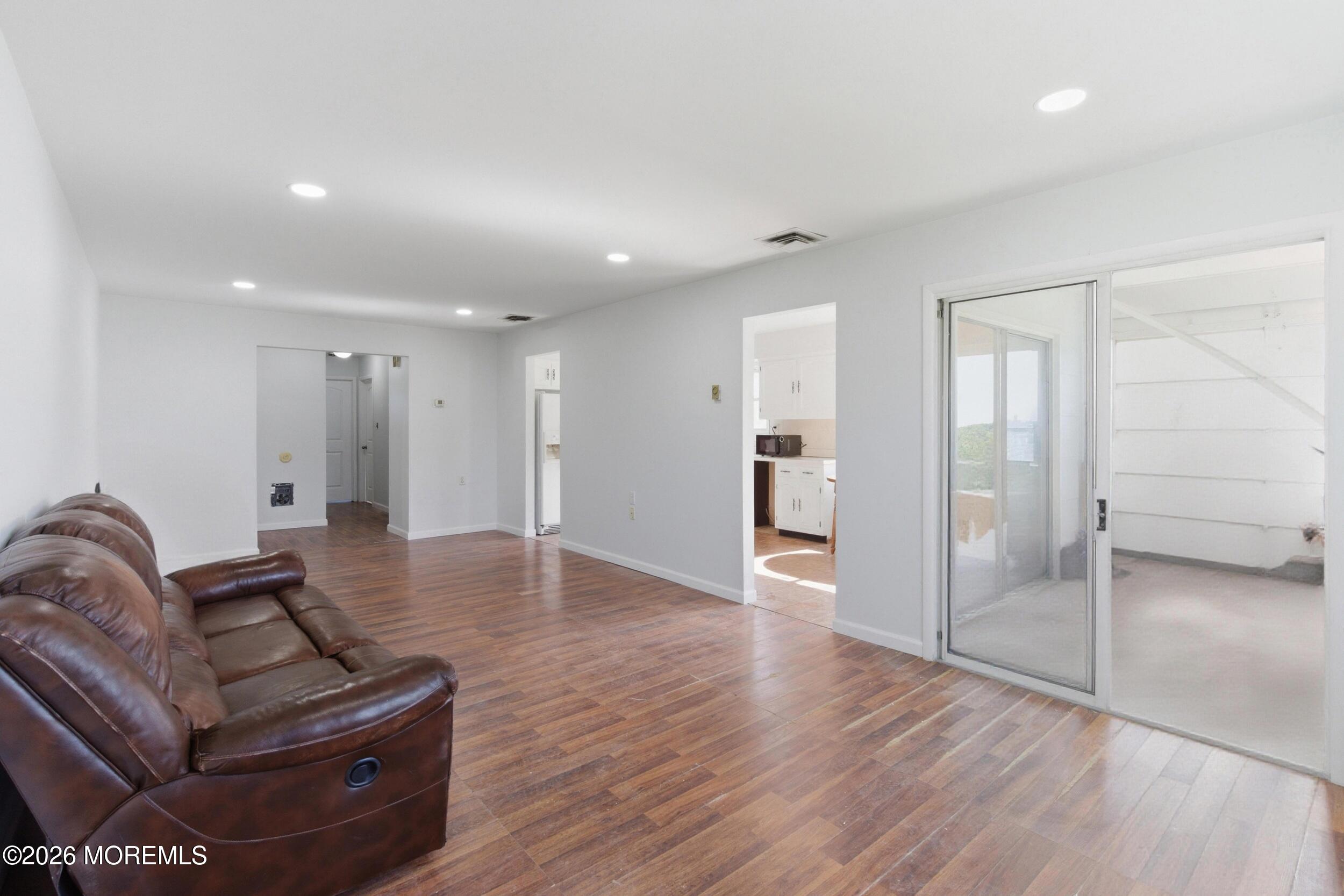 93 Baser Lane Brick, NJ 08724 - Photo 5 of 21 a living room with furniture and a hard wood floor