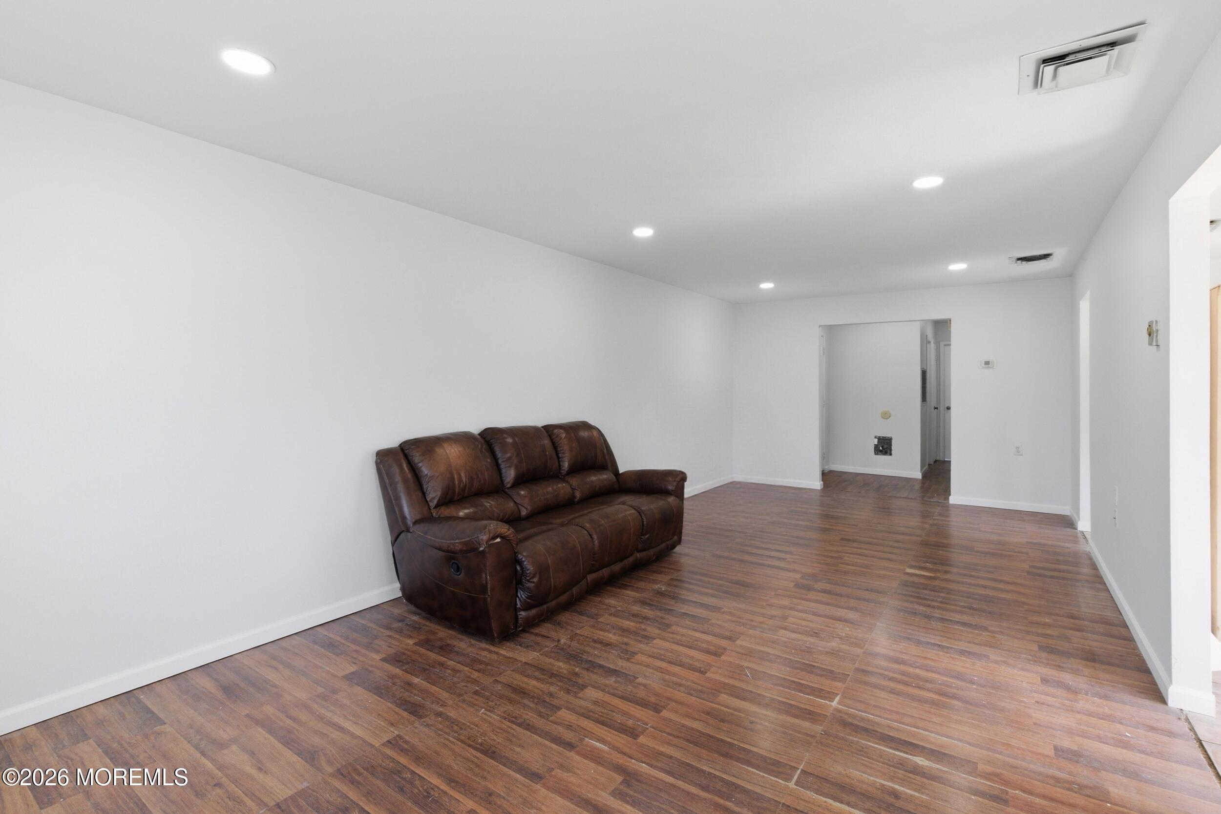 93 Baser Lane Brick, NJ 08724 - Photo 6 of 21 a big room with wooden floor and windows